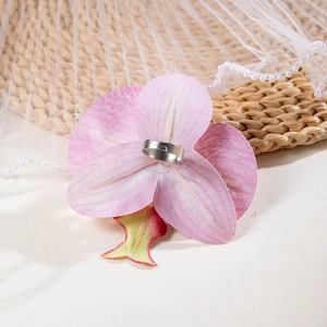 Macro detail of 3D printed pink orchid ring with pearl accents and floral petal texture