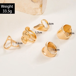 Detailed view of irregular gold rings set with 33.5g weight and inner diameter details