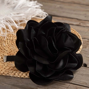 Detailed view of a handmade black satin rose choker with layered 3D floral petals