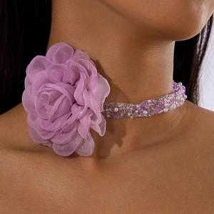Close-up of lavender fabric flower choker necklace with purple and white beaded strands