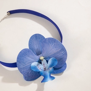Detailed view of blue orchid flower choker with velvet strap and silver lobster clasp