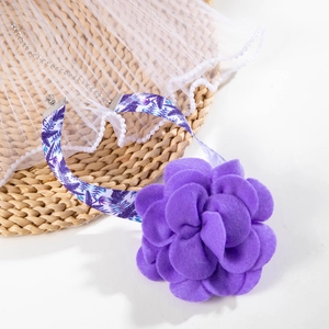 Detail of purple felt flower necklace with floral ribbon and adjustable silver lobster clasp