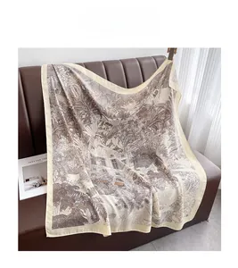 Detailed view of silk scarf with tropical rainforest and classical building print
