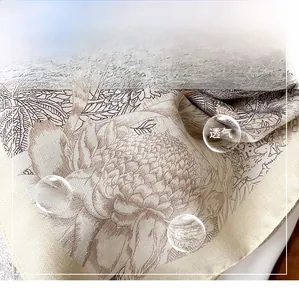 Close-up of premium twill silk scarf showing vintage floral print and fine rolled edges