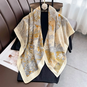 Elegant 90x90cm floral scarf with tropical print over a black turtleneck background