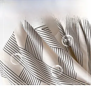 Detailed macro shot of the premium twill silk fabric with black geometric stripes