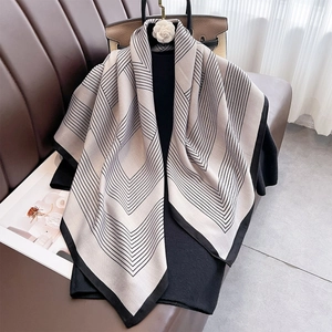 Classic beige silk scarf with black V-shaped geometric stripes and wide border accent