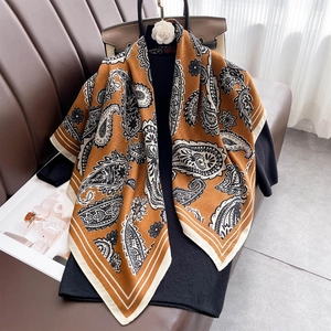 Classic caramel paisley print large square scarf styled with a black knit top for women