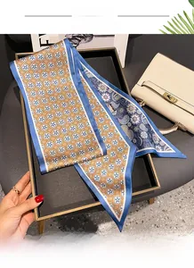 Detailed close-up of double-sided paisley print silk scarf with fine hemming technique