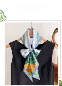 Artistic oil painting silk scarf in light blue shown on a wooden hanger with a black dress