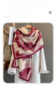 Close-up of imitation cashmere scarf with classic galloping horse print on white coat