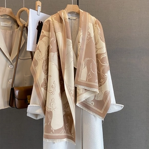 Elegant khaki cashmere-feel scarf with running horse print and fringe on a white coat