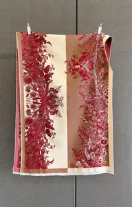 Detail of vintage floral print scarf with soft tassels and intricate pattern design