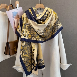 Detail of vintage floral pattern scarf with tassel edges and contrast navy border