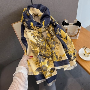 Close-up of vintage floral print scarf with soft tassels and two-tone texture