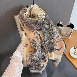 Detail of floral and bird print on pashmina shawl with fine fringe edges