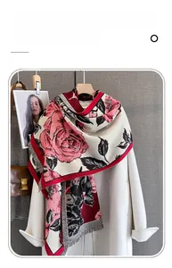 Detail of vintage rose print on imitation cashmere scarf with tassel edges