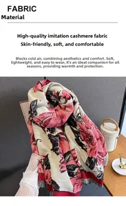 Detail of pink floral faux cashmere scarf showing elegant tassels and soft fabric texture