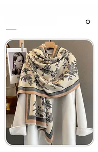 Detailed texture of imitation cashmere scarf featuring vintage floral bird prints