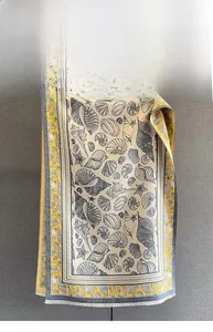 Detail view of seaside seashell and starfish prints on a cashmere-feel scarf