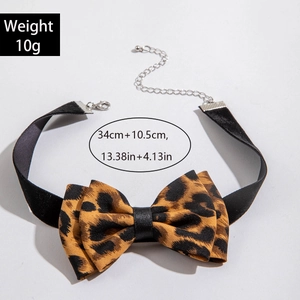 Detailed view of leopard print bow choker necklace with adjustable chain length and weight info