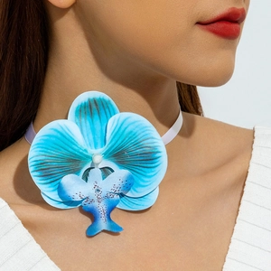 Detailed view of the gradient blue orchid fabric flower choker with a white ribbon tie