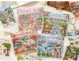 Macro shot of 3D seasonal landscape stickers featuring vintage European architecture