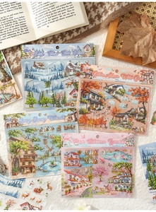 Flat lay of four seasonal DIY journal stickers featuring Chinese landscapes and animals