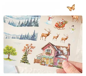 Detail of matte PET winter stickers featuring Santa Claus and reindeer for DIY journals