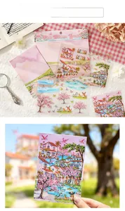 Macro detail of transparent PET stickers featuring 3D landscape architecture and cherry trees
