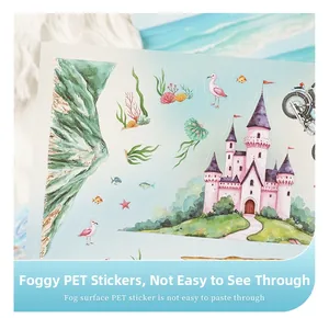 Macro shot of matte PET scenery stickers featuring watercolor castles and marine life