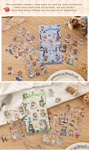 Detail view of 4-sheet animal stickers with cute cat and dog themes on wooden table