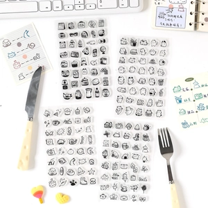 Hand-drawn transparent PET stickers featuring cute cat and food illustrations for journaling