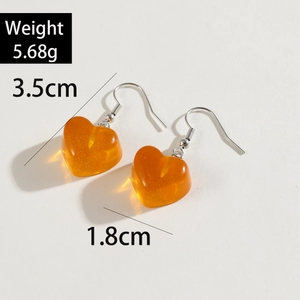 Translucent orange heart drop earrings with gold glitter and silver hooks, 3.5cm length