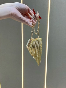 Elegant diamond-encrusted triangular evening bag with long rhinestone fringe tassels