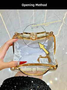 Detail view of pearl evening bag interior with gold chain and rhinestone clasp guide