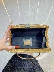 Luxury gold evening handbag with crystal flower clasp and gold metal chain strap