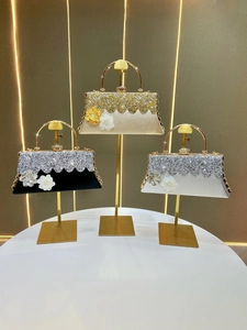 Luxury rhinestone evening handbags in gold, black, and silver with metal handles