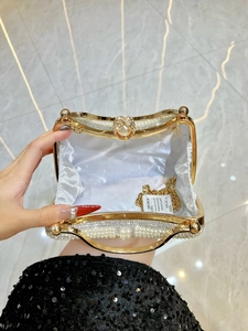 Elegant pearl evening clutch with rhinestone trim and gold chain strap for women