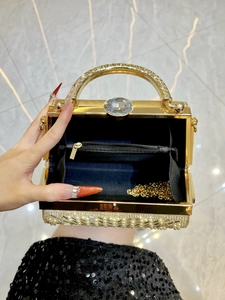 Elegant gold evening handbag with pearl embellishments and diamond handle for women