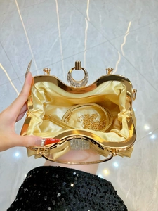 Luxurious gold pleated evening clutch with rhinestone buckle and metal ring handle