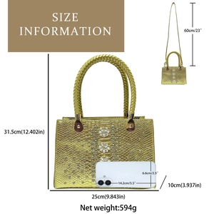 Detail view of gold snakeskin texture evening bag with rhinestone flowers and size guide
