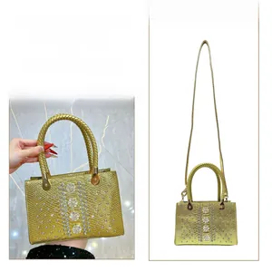 Detailed view showing crossbody and handbag styles with rhinestone flower embellishments