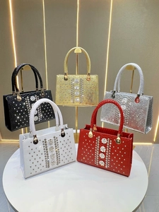 Luxury rhinestone evening handbags for women in five colors displayed on elegant pedestals