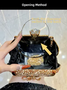 Macro shot of rhinestone evening clutch showing black satin interior and gold chain strap