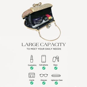 Detail view of gold rhinestone bow evening bag showing large interior capacity for cosmetics