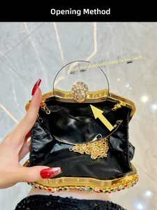 Detail of golden evening bag showing diamond clasp, black lining, and chain strap
