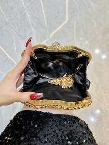 Elegant gold wavy evening bag with colorful crystals and detachable chain strap