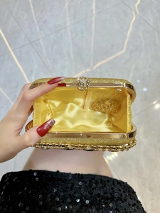 Elegant gold sequined evening clutch with diamond clasp and detachable chain strap
