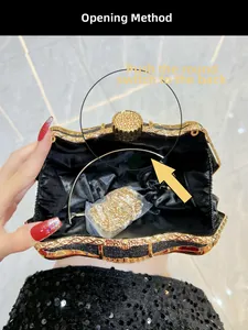 Detail of evening clutch interior with satin lining and gold chain strap inside